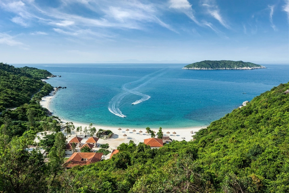 Cu Lao Cham, a UNESCO Biosphere Reserve, is a cluster of eight pristine islands known for crystal-clear waters, vibrant coral reefs, and lush jungle trails